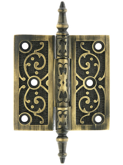 3 inch Solid Brass Steeple Tip Hinge With Decorative Vine Pattern in Antique Brass.